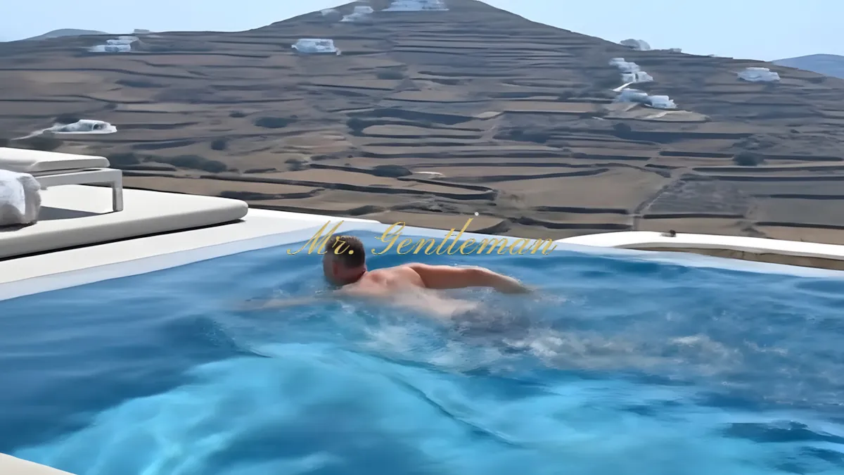 Mr. Gentleman swimming in a private villa pool above the hills in Lasithi, Crete