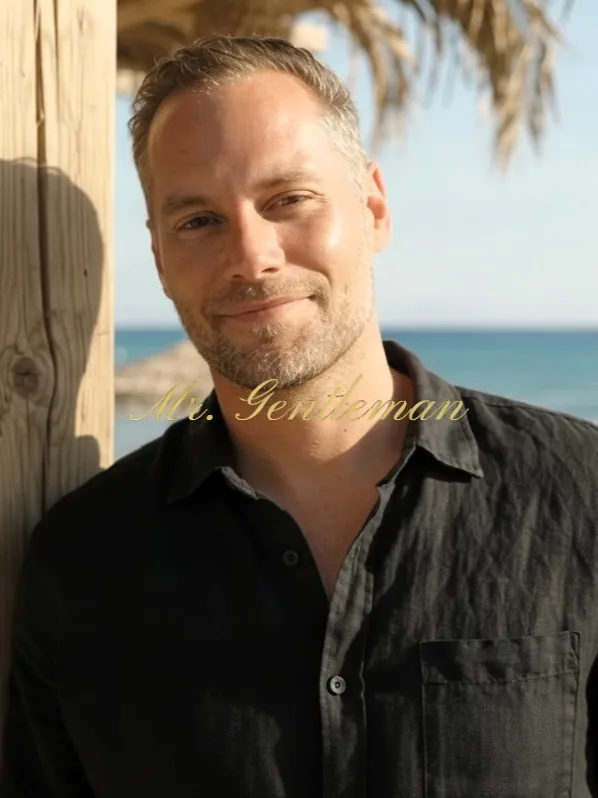 Close portrait of a smiling Mr. Gentleman at a beach bar in Istron, Crete