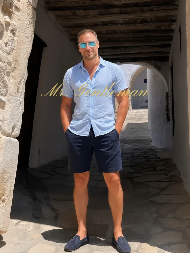 Mr. Gentleman in a light blue shirt in a covered old town passage in Crete