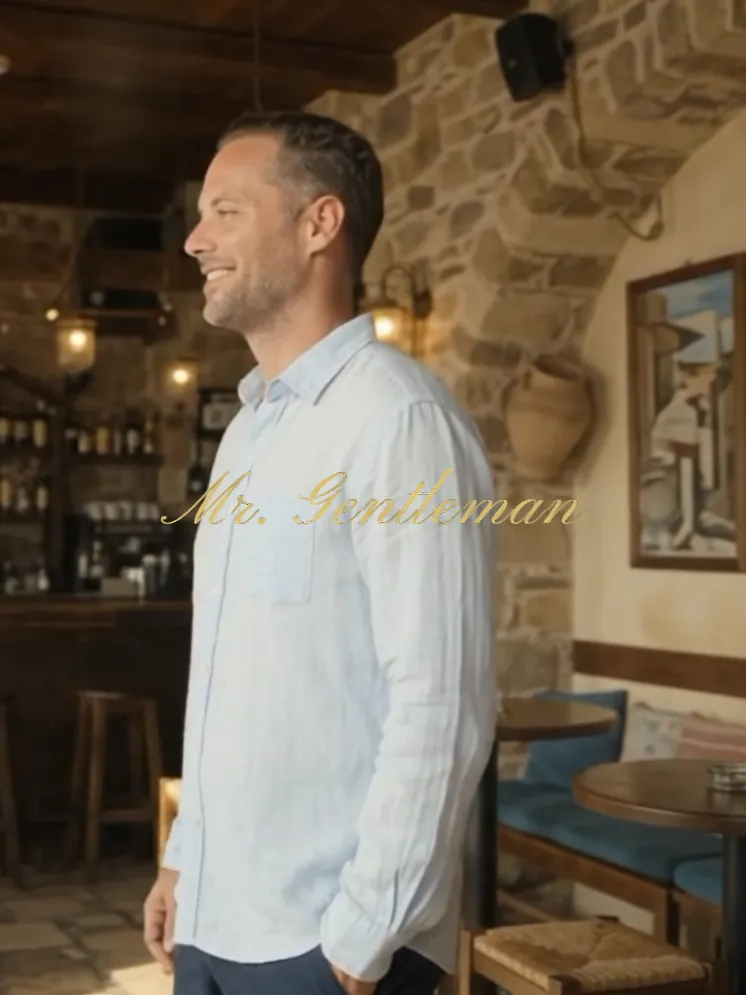 Smiling Mr. Gentleman in a light shirt in a cosy taverna in Bali, Crete