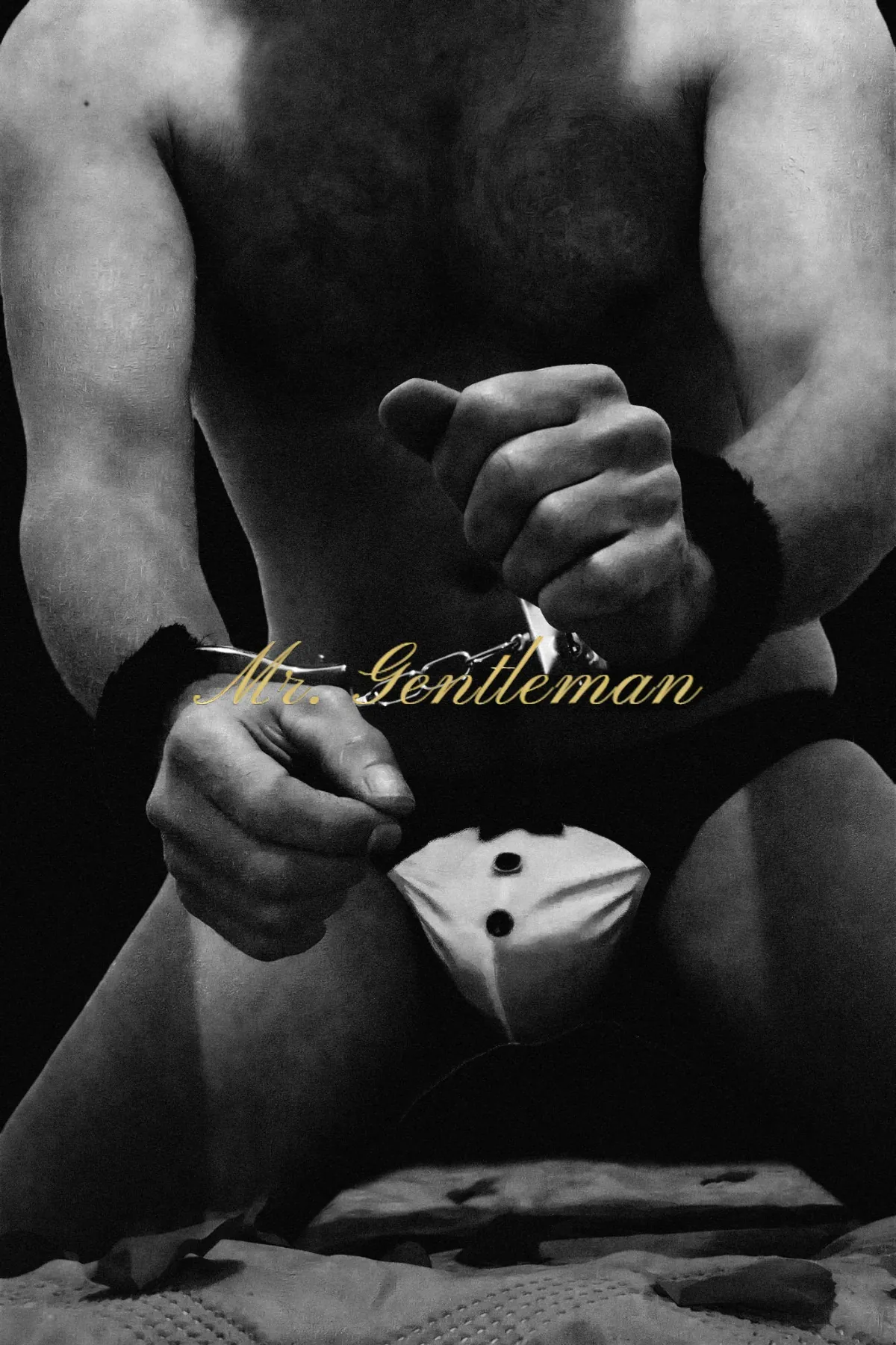 Black and white close-up of hands with soft restraints