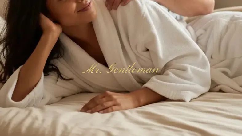 A woman in a soft robe relaxing on the bed after a wellness massage in Lasithi, Crete